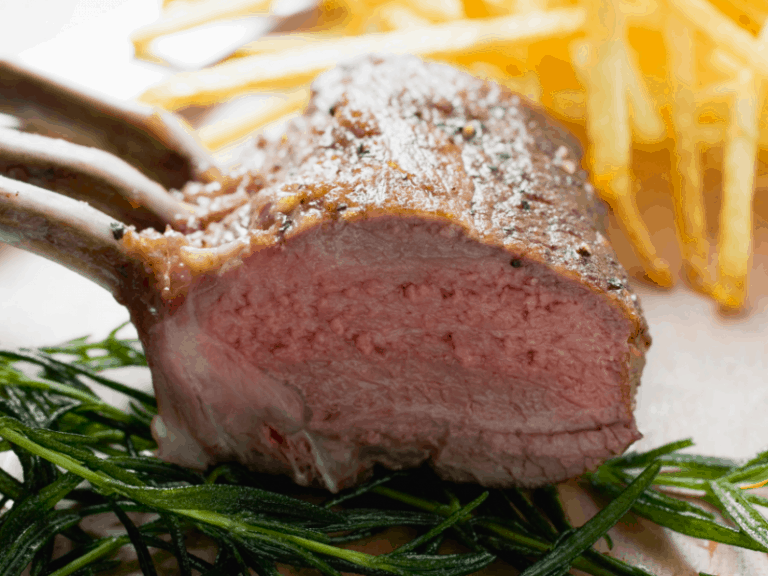 herb-crusted-rack-of-lamb-on-a-palte-with-roasted-carrots-lamb